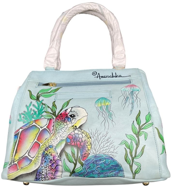 ANUSCHKA HAND-PAINTED LEATHER "OCEAN REEF" SATCHEL: ANUSCHKA HAND-PAINTED LEATHER "OCEAN REEF" SATCHEL BAG THIS STUNNING AND ARTISTIC SATCHEL FROM ANUSCHKA IS CRAFTED FROM GENUINE PALE BLUE LEATHER AND FEATURES AN ELABORATE, HAND-PAINTED "OCEAN REEF" M