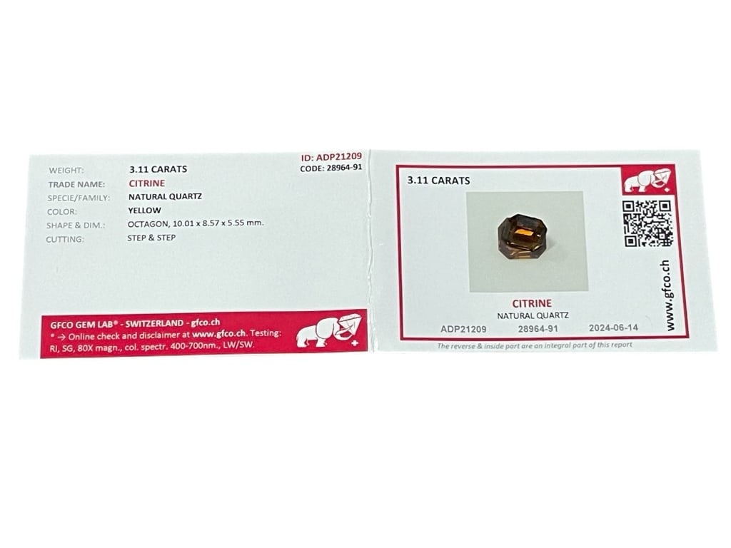 GFCO CERTIFIED 3.11 CARAT NATURAL CITRINE: GFCO CERTIFIED 3.11 CARAT NATURAL CITRINE – OCTAGON STEP CUT, YELLOW QUARTZ -This certified natural citrine displays a warm yellow tone with excellent depth and clarity. Weighing 3.11 carats, the ge