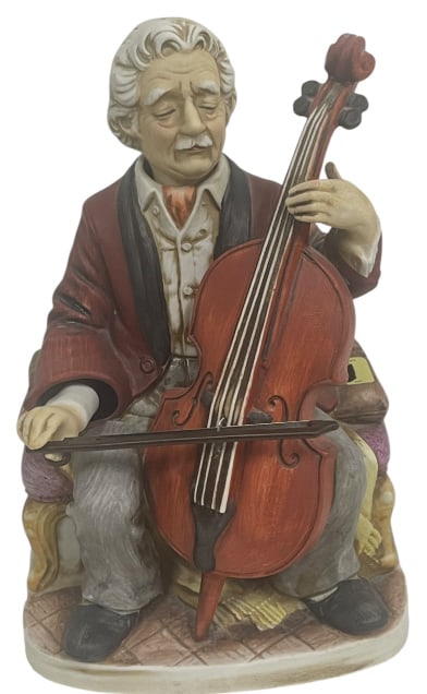 WACO MELODY IN MOTION THE CELLIST MUSIC BOX: WACO MELODY IN MOTION THE CELLIST MUSIC BOX This exquisite vintage porcelain figurine from the renowned Melody In Motion collection by Waco Japan features a masterfully detailed cellist in mid-perform