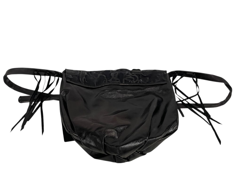 EMBOSSED BLACK LEATHER SHOULDER BAG: EMBOSSED BLACK LEATHER SHOULDER BAG (UNBRANDED / ARTISAN STYLE)Soft leather with floral embossing and ring detail; condition appears gently used.