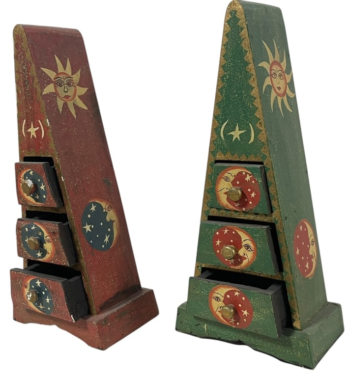 VINTAGE CELESTIAL SUN & MOON WOODEN TRINKET DRAWES: VINTAGE CELESTIAL SUN & MOON WOODEN TRINKET DRAWERS This unique pair of vintage wooden trinket chests features a whimsical celestial theme with hand-painted sun, moon, and star motifs. Each pyramid-sh