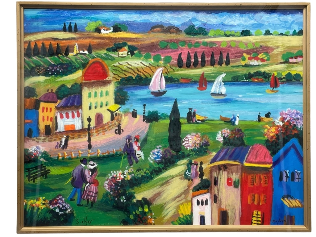 FRAMED NA?VE STYLE COLORFUL VILLAGE & LAKESIDE: FRAMED NA?VE STYLE COLORFUL VILLAGE & LAKESIDE SCENE "PARADISE CITY" ALTER. SHLOMO 351/ 490 Vibrant naïve-style artwork depicting a whimsical lakeside village with sailboats, rolling countryside, and