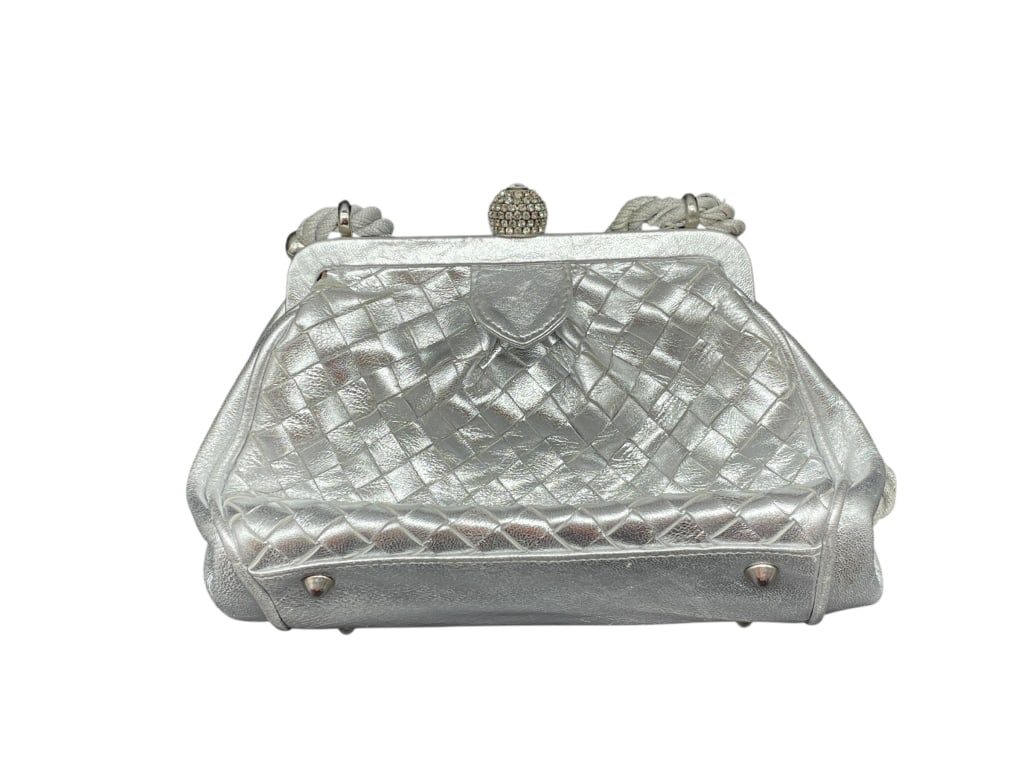 SISO SILVER METALLIC WOVEN LEATHER EVENING BAG: SISO MADE IN ITALY SILVER METALLIC WOVEN LEATHER EVENING BAG WITH RHINESTONE CLASP AND ROPE STRAP Italian-made SISO evening bag crafted in silver metallic woven leather, featuring a softly structured