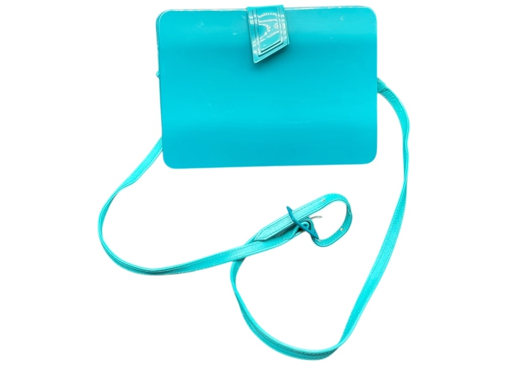 CUL DE SAC TURQUOISE PATENT LEATHER CROSSBODY BAG: CUL DE SAC TURQUOISE PATENT LEATHER CROSSBODY BAG – MADE IN ITALY Striking Cul de Sac crossbody handbag crafted in Italy from glossy turquoise epoxy exterior with leather ends and bottom. This sleek