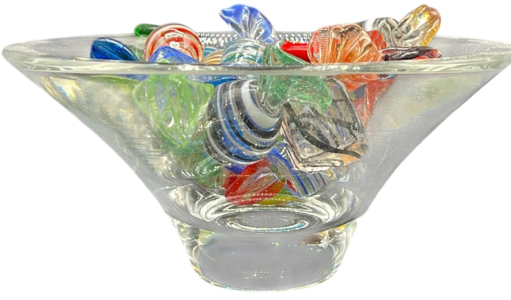 ARTISAN GLASS CANDY & CRYSTAL BOWL COLLECTION: ARTISAN GLASS CANDY & CRYSTAL BOWL COLLECTION THIS VIBRANT AND PLAYFUL ESTATE LOT FEATURES A SUBSTANTIAL COLLECTION OF HAND-BLOWN ART GLASS CANDIES PRESENTED IN A HIGH-QUALITY CRYSTAL SERVING BOWL. TH