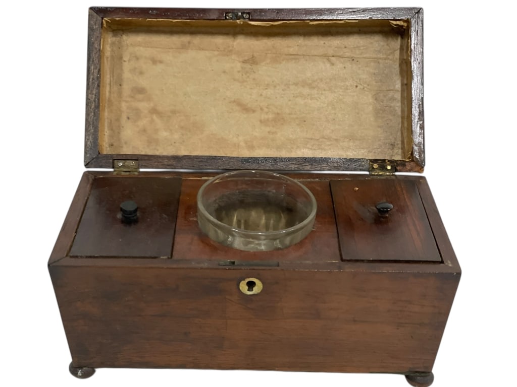 ANTIQUE REGENCY WALNUT TEA CADDY CASKET: REGENCY WALNUT TEA CADDY CASKET WITH GLASS BOWL INSERT -Early 19th century Regency-style walnut tea caddy casket, featuring a hinged lid, original key escutcheon, raised feet, and a fitted interior wi