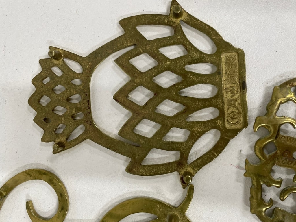 DECORATIVE BRASS MONOGRAM & SCROLLWORK TRIVETS - 13