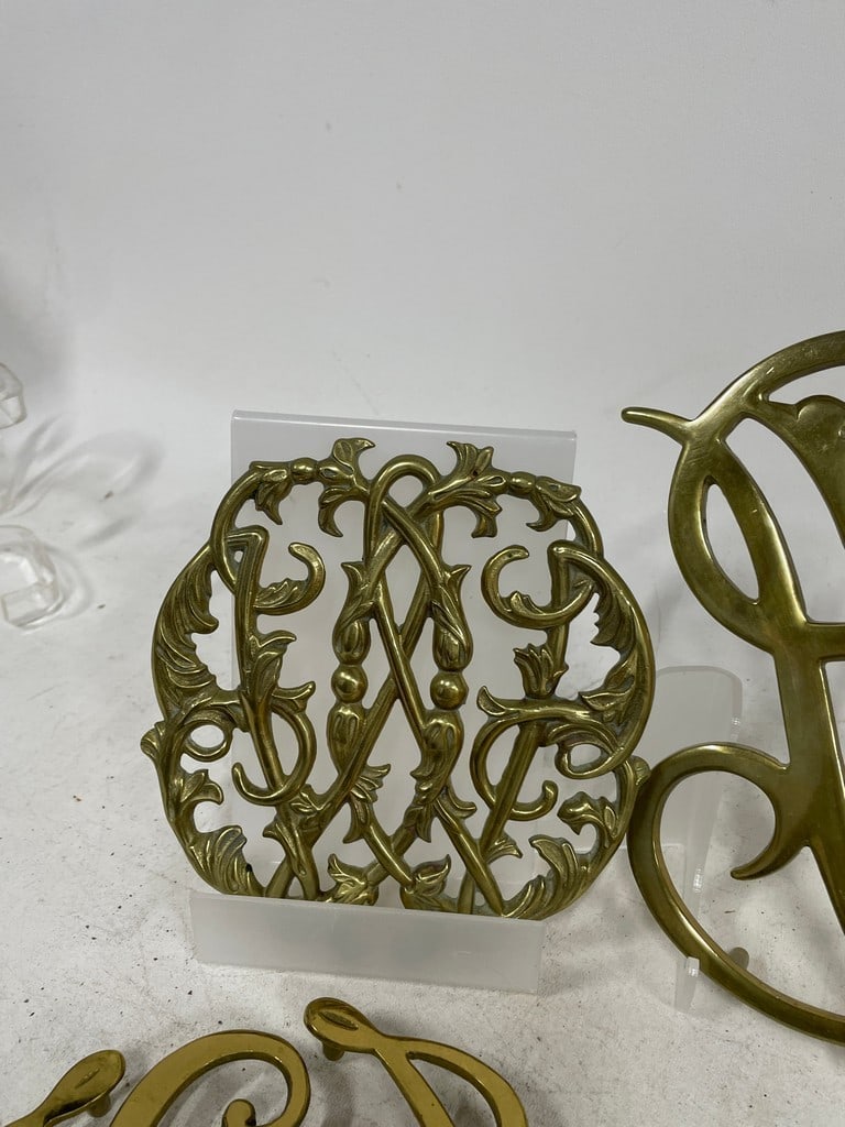 DECORATIVE BRASS MONOGRAM & SCROLLWORK TRIVETS - 5