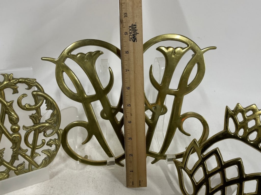 DECORATIVE BRASS MONOGRAM & SCROLLWORK TRIVETS - 9