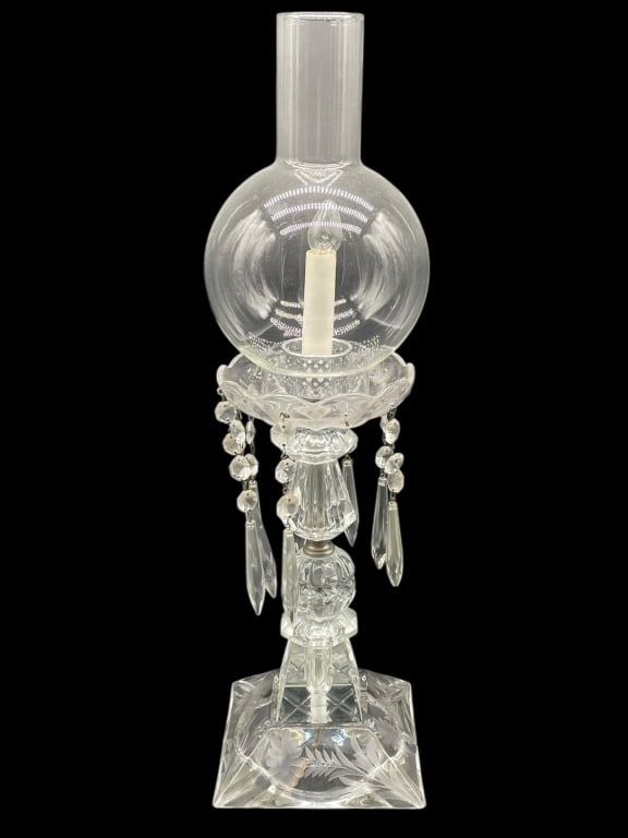 CUT CRYSTAL LUSTRE CANDLE LAMP 21": CUT CRYSTAL LUSTRE CANDLE LAMP WITH GLASS GLOBE AND HANGING PRISMS 21" X 5" D APPROX -Elegant cut crystal lustre candle lamp featuring a faceted square base with etched floral decoration, turned cryst