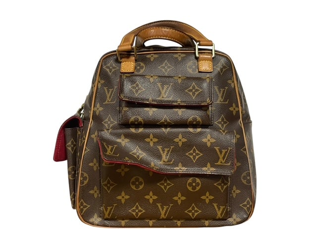 LOUIS VUITTON EXCENTRI-CITE SMALL BACKPACK PURSE: *For ALTERNATIVE SHIPPING QUOTES, please visit www.dejavuauctionshipping.com* LOUIS VUITTON EXCENTRI-CITE SMALL BACKPACK PURSE - Stunning little design by Louis Vuitton - outside of bag in coated leat