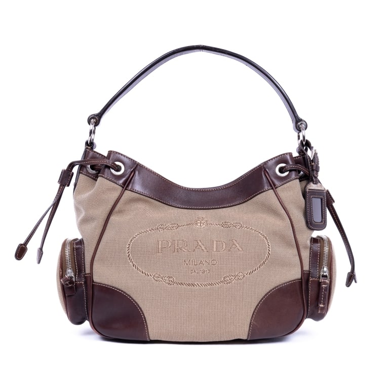 PRADA JAQUARD BEIGE/DARK BROWN JACQUARD LOGO HOBO: *For ALTERNATIVE SHIPPING QUOTES, please visit www.dejavuauctionshipping.com* Prada Jaquard Hobo Beige/Dark Brown Jacquard Logo Canvas Silver * COLOR: Beige/Dark Brown * PRODUCTION CODE: 129 * INCLUDE
