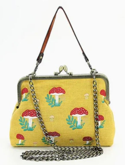 NEW! YELLOW MUSHROOM KISSLOCK HANDDBAG: *For ALTERNATIVE SHIPPING QUOTES or local pick up details, please visit www.dejavuauctionshipping.com* NEW! YELLOW MUSHROOM KISSLOCK HANDDBAG Step into nature with elegance with this mushroom kisslock
