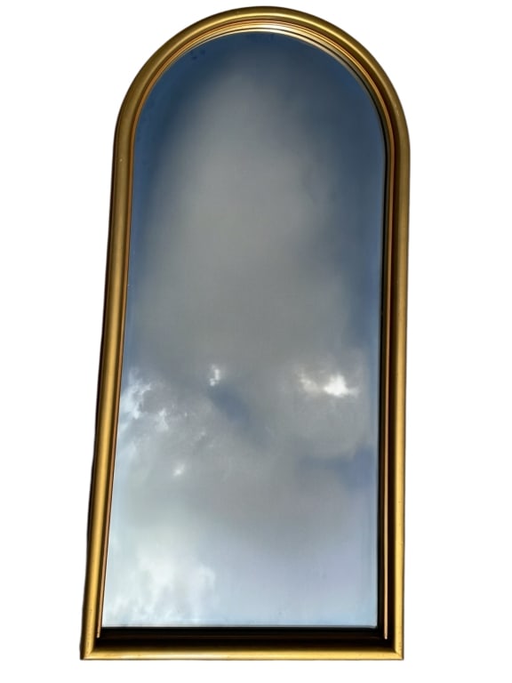 ARCHED GILT FRAMED WALL MIRROR 49": *for alternative shipping options please go to www.dejavuauctionshipping.com -ARCHED GILT FRAMED WALL MIRROR 49" X 23.5" APPROX -Elegant arched wall mirror featuring a classic gilt frame with softly r