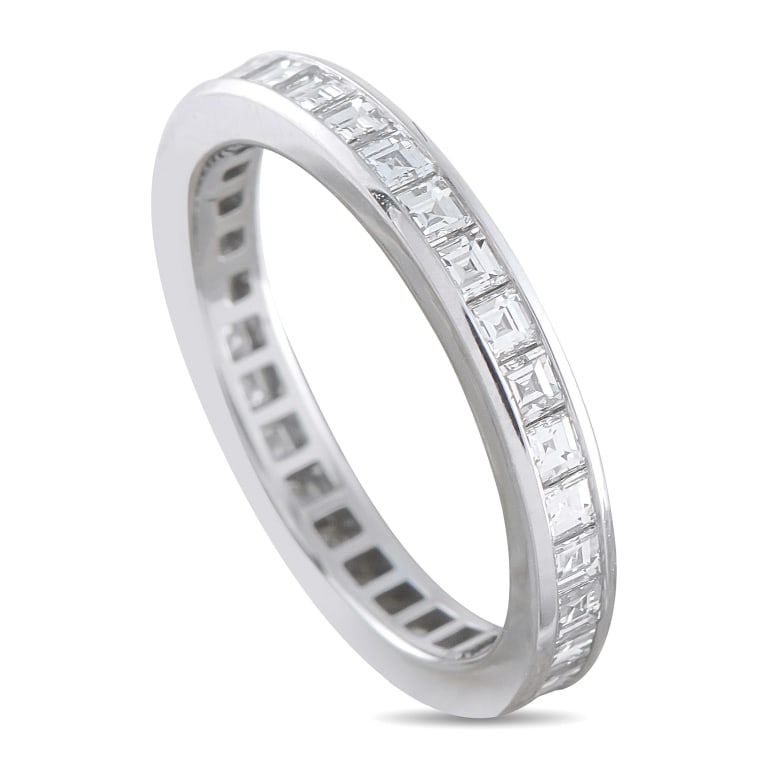TIFFANY & CO PLATINUM 1.02CT DIAMOND ETERNITY RING: *SPECIAL SHIPPING on Luxury Jewelry READ BELOW* This Tiffany & Co. eternity ring presents a full channel of square-cut diamonds encircling a slender 2mm platinum band, totaling 1.02 carats. The channe