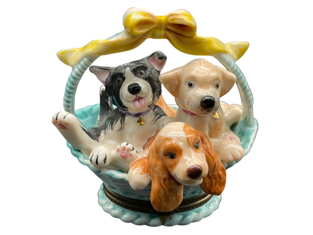 HAND PAINTED DOGS IN BASKET TRINKET BOX: For ALTERNATE shipping quote or LOCAL PICK-UP DETAILS, please visit dejavuauctionshipping.com HAND PAINTED DOGS IN BASKET TRINKET BOX Charming hand-painted ceramic trinket box featuring three playful