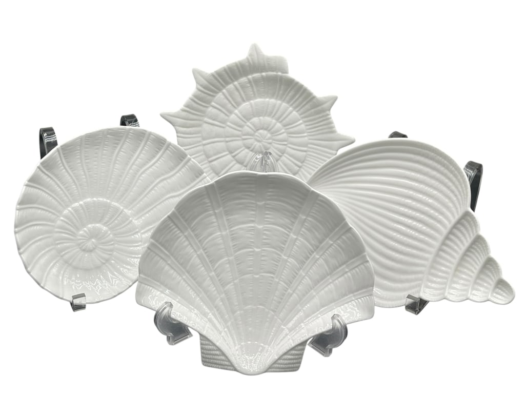 LOT OF 4 WHITE SHELL SERVING PLATES SET: For ALTERNATE shipping quote or LOCAL PICK-UP DETAILS, please visit dejavuauctionshipping.com WHITE CERAMIC SEASHELL SHAPED SERVING PLATES COASTAL DECOR TABLEWARE SET OF FOUR Decorative group of four
