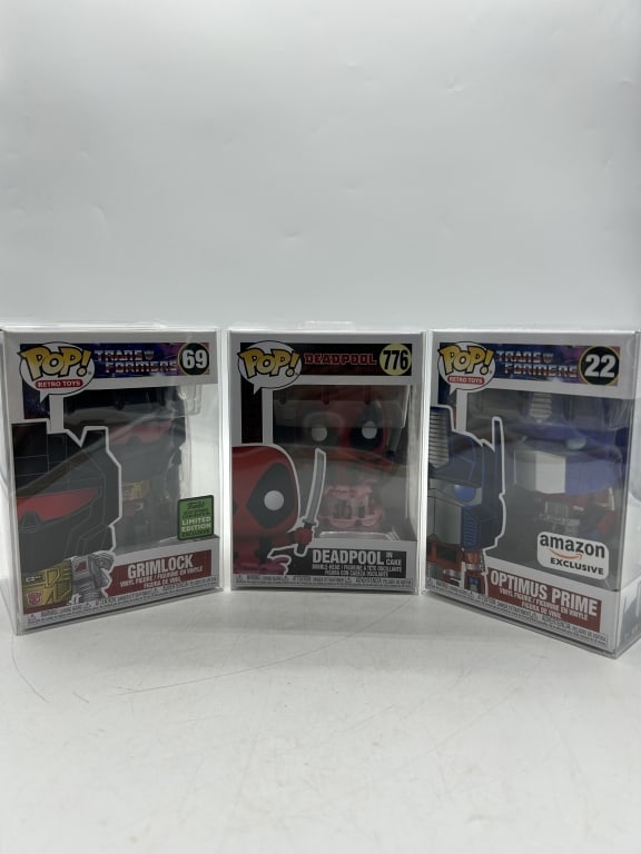 3 FUNKO POP TRANSFORMERS DEADPOOL BOX FIGURE LOT: For ALTERNATE shipping quote or LOCAL PICK-UP DETAILS, please visit dejavuauctionshipping.com FUNKO POP VINYL FIGURE LOT OPTIMUS PRIME AMAZON EXCLUSIVE GRIMLOCK DEADPOOL Group lot of Funko Pop! vinyl
