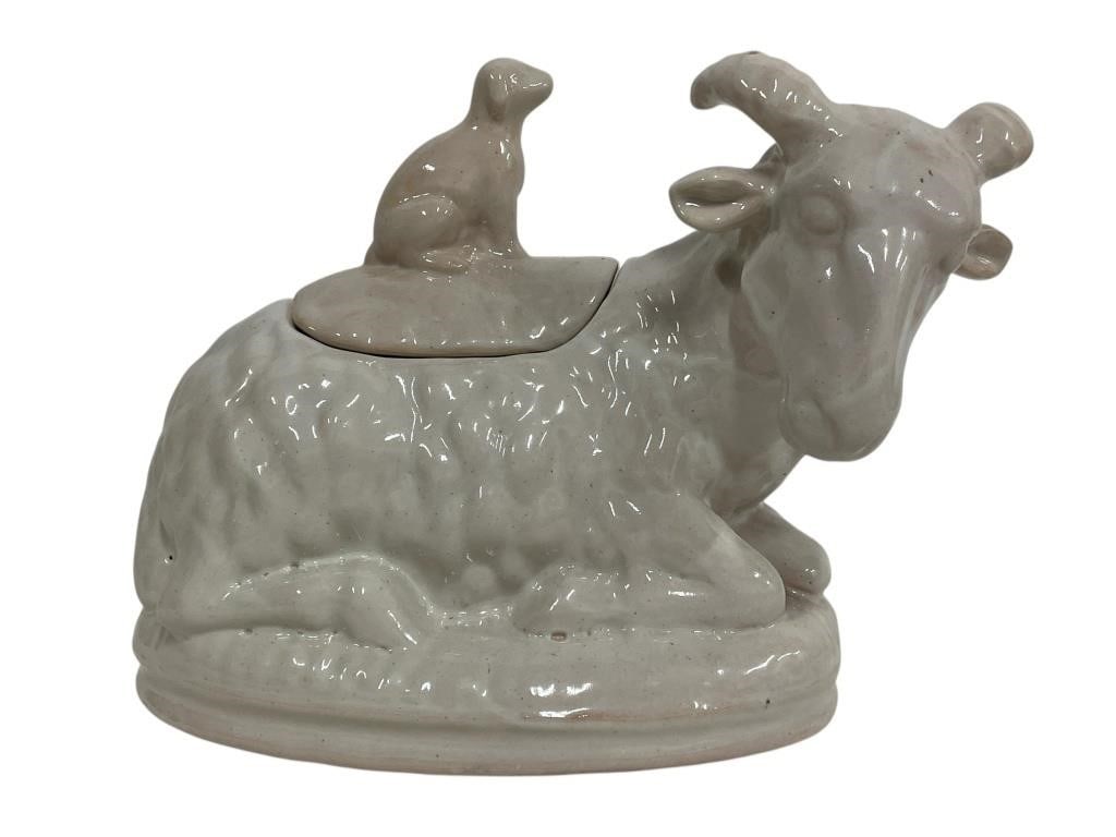 VINTAGE TERRA COTTA POTTERY GOAT W/DOG TUREEN 12": VINTAGE CERAMIC GOAT WITH DOG LID COOKIE JAR 12" SIGNED BY ARTIST. -Very good pre owned condition -Approx 9"h x 12"w -This charming vintage terra cotta pottery tureen features a sculpted reclining ram