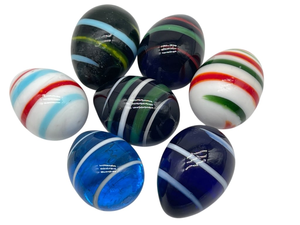 LOT OF 7 VINTAGE HAND-BLOWN ART GLASS MARBLES: For ALTERNATE shipping quote or LOCAL PICK-UP DETAILS, please visit dejavuauctionshipping.comColorful grouping of seven hand-blown art glass marbles or small paperweights featuring vibrant striped