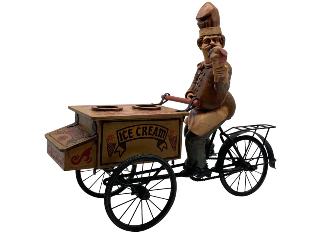 WHIMSICAL ICE CREAM VENDOR FIGURAL BICYCLE CART: For ALTERNATE shipping quote or LOCAL PICK-UP DETAILS, please visit dejavuauctionshipping.comCharming figural decorative piece featuring a mustachioed ice cream vendor riding a vintage-style tricycle