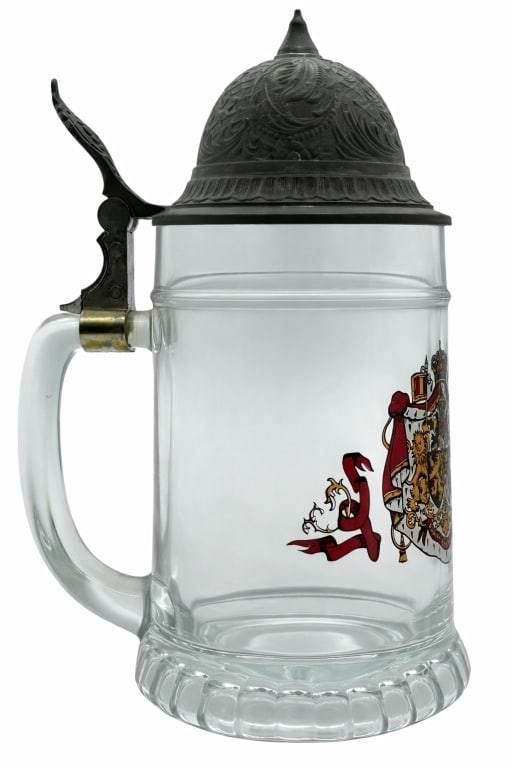 GERMAN BEER STEIN PEWTER LID WITH HERALDIC CREST: GERMAN STYLE GLASS BEER STEIN WITH PEWTER LID HERALDIC CREST Traditional German-style glass beer stein featuring a clear molded body with heavy base, decorated with a detailed multicolor heraldic cres