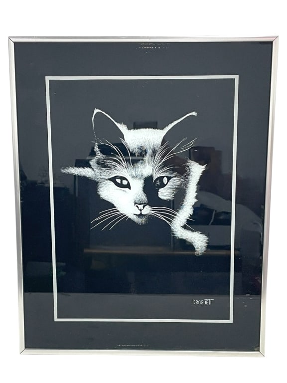 DROGUETT FRAMED CLEOPATRA'S CAT PRINT 20.5": DROGUETT FRAMED CLEOPATRA'S CAT PRINT 20.5" -VERY GOOD PRE OWNED CONDITION -APPROX 16" X 1" X 20.5" -FRAMED BLACK AND WHITE ART PRINT DEPICTING A CAT’S FACE EMERGING FROM A DARK BACKGROUND, RENDERED