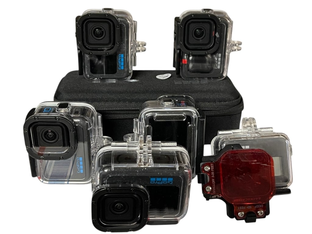 LOT OF 6 GOPRO ACTION CAMERAS WITH CASES & ACCESSS: For ALTERNATE shipping quote or LOCAL PICK-UP DETAILS, please visit dejavuauctionshipping.comLOT OF 6 GoPro ACTION CAMERAS WITH PROTECTIVE HOUSINGS AND CASESGroup of six GoPro action cameras housed
