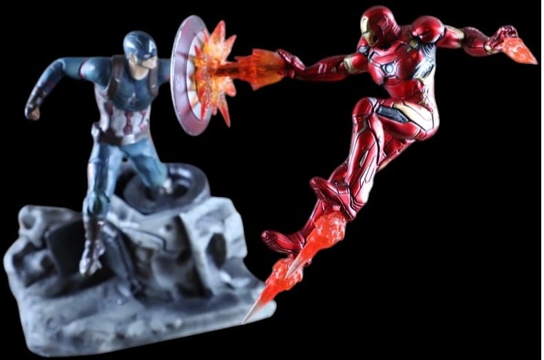 MARVEL AVENGERS IRON MAN CAPTAIN AMERICA DIORAMA: MARVEL AVENGERS IRON MAN AND CAPTAIN AMERICA DIORAMA STATUE Marvel Avengers themed diorama-style collector statue featuring Iron Man and Captain America in dynamic battle poses with translucent blast