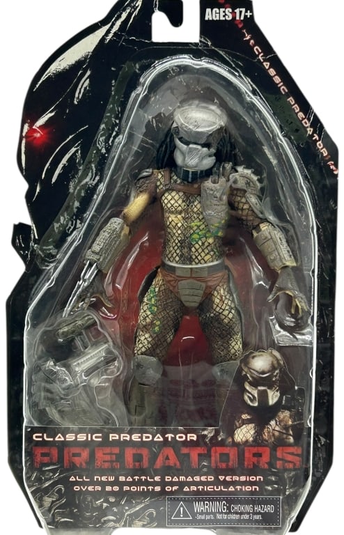 PREDATORS CLASSIC PREDATOR ACTION FIGURE: PREDATORS CLASSIC PREDATOR BATTLE DAMAGED ACTION FIGURE Predators Classic Predator action figure in battle damaged version, presented in original blister card packaging with character artwork and acce