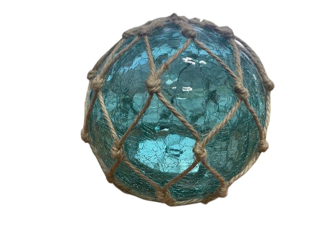 CRACKLE GLASS ROPE WRAPPED NAUTICAL FLOAT DECOR: Key details: The glass sphere has a crackled or textured surface, giving it a vintage or weathered look. A thick, tan rope net is tightly knotted around it, forming a diamond pattern—this is typical