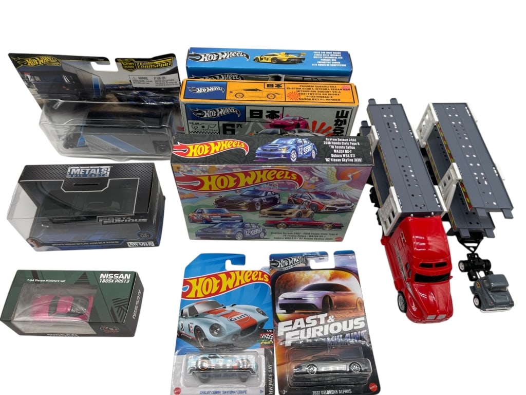 LOT OF 10 DIE CAST CARS HOT WHEELS FAST FURIOUS: MIXED LOT OF DIE CAST VEHICLES HOT WHEELS SETS AND CAR TRANSPORTER Mixed lot of die-cast vehicle collectibles including Hot Wheels boxed sets, carded single vehicles, a red car transporter truck with