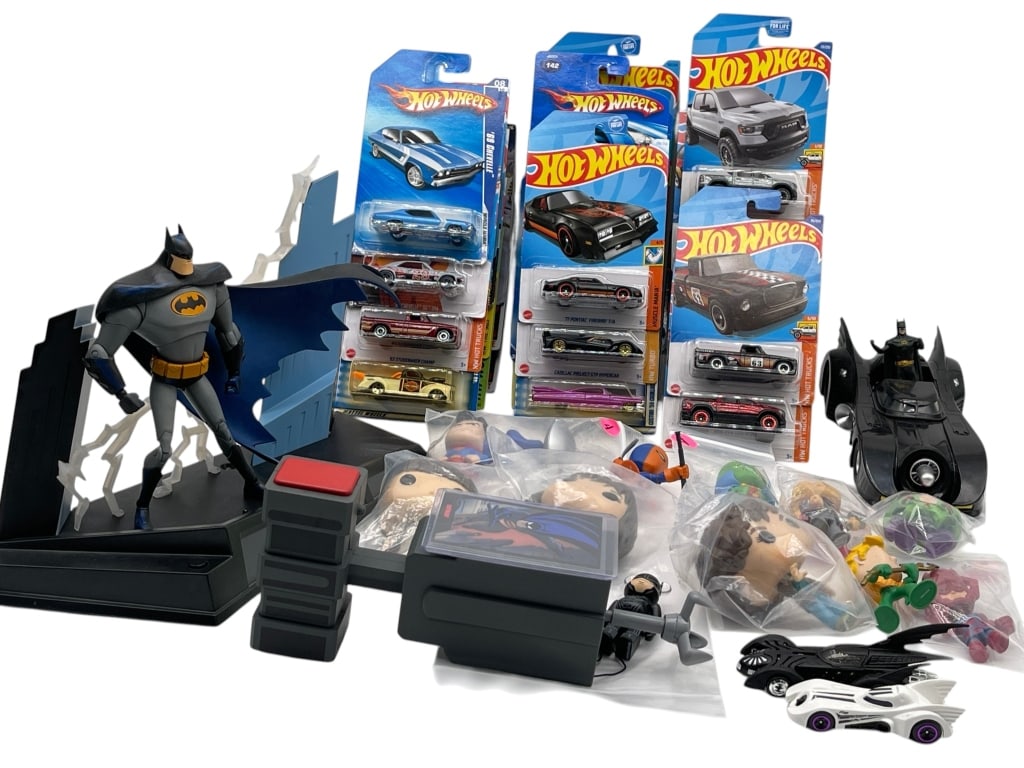 MIXED LOT OF BATMAN HOT WHEELS TOYS FIGURES: MIXED LOT OF BATMAN HOT WHEELS TOYS FIGURES AND POP CULTURE ITEMS Mixed lot of Batman and pop culture collectibles including Hot Wheels carded die-cast vehicles, Batman figures, Batmobile-style toy ca