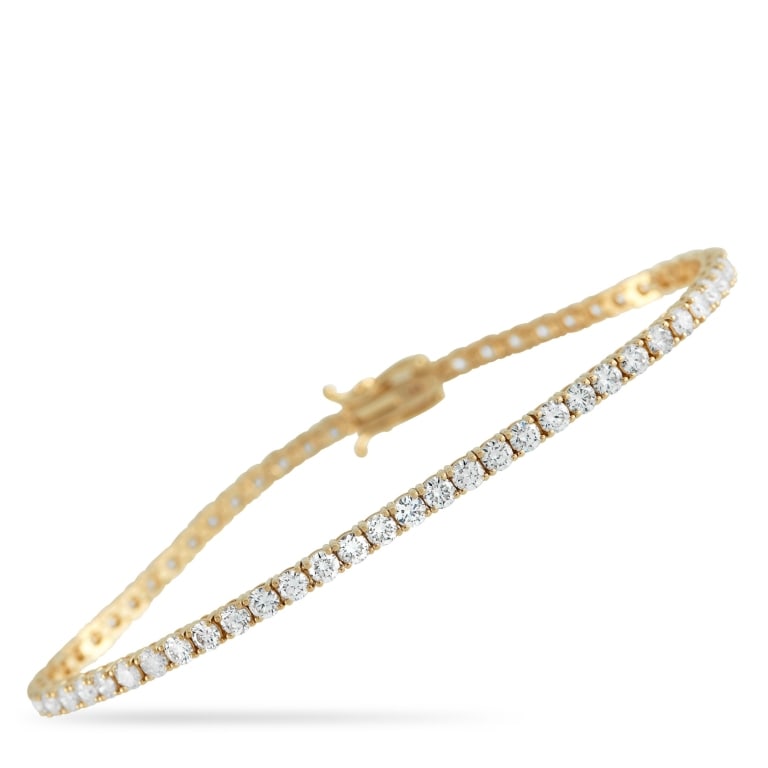 14K YELLOW GOLD 4.50CT LAB DIAMOND TENNIS BRACELET: *SPECIAL SHIPPING on Luxury Jewelry READ BELOW* This classic tennis bracelet is perfect for anyone who appreciates quiet luxury. Simple and elegant, this elevated piece comes to life thanks to a serie