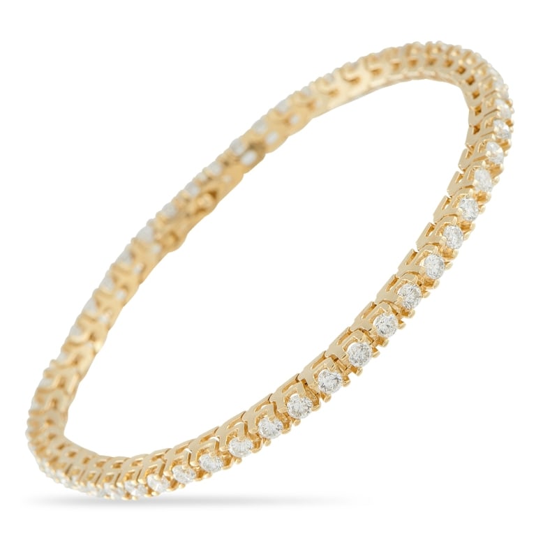 14K YELLOW GOLD 2.50CT DIAMOND TENNIS BRACELET: *SPECIAL SHIPPING on Luxury Jewelry READ BELOW* This tennis bracelet is an instant classic. Set in 14K Yellow Gold, a series of sparkling Diamonds totaling 2.50 carats make it an exquisite luxury piec