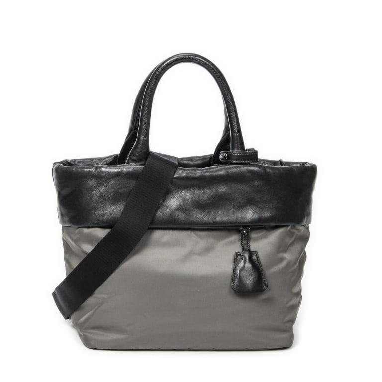 PRADA REVERSIBLE TOTE GREY/BLACK NYLON BAG: Prada Reversible Tote Grey/Black Nylon Canvas Aged Brass * COLOR: Grey/Black * PRODUCTION CODE: 1BG959 * INCLUDED: Card, Strap, Handle Strap, Charm in Clochette A * CONDITION: 28*24*17cm * (3cm = 1inc