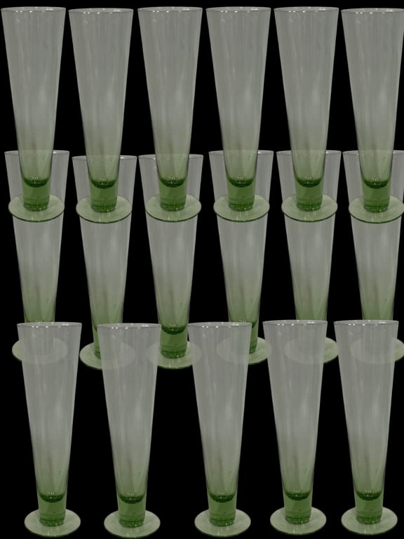 17 EMERALD STEM CHAMPAGNE FLUTES 10": *for alternative shipping options please go to www.dejavuauctionshipping.com -LOT OF 17 EMERALD STEM CHAMPAGNE FLUTES / PILSNER 10" X 3" APPROX -Elegant set of seventeen tall champagne flutes featurin