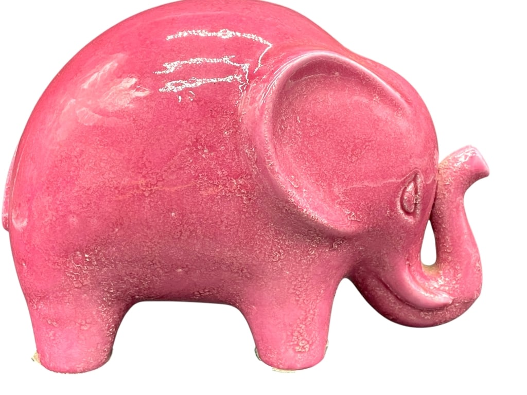 CERAMIC PINK ELEPHANT FIGURAL SCULPTURE 8": *for alternative shipping options please go to www.dejavuauctionshipping.com -CERAMIC PINK ELEPHANT FIGURAL SCULPTURE 6" X 8" X 4" APPROX -Decorative ceramic elephant figural sculpture featuring a sty