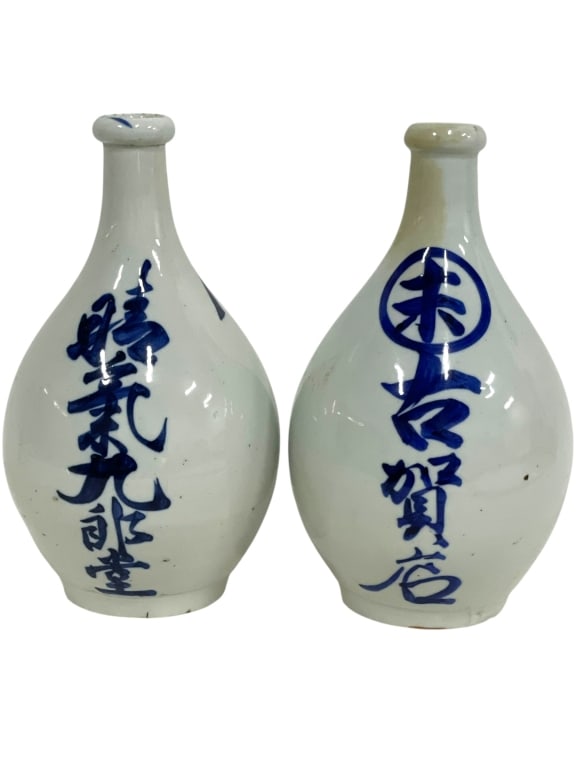JAPANESE BLUE & WHITE PORCELAIN SAKE BOTTLES 11": *for alternative shipping options please go to www.dejavuauctionshipping.com -PAIR OF JAPANESE BLUE AND WHITE PORCELAIN SAKE BOTTLES -Pair of traditional Japanese blue and white porcelain sake bottles