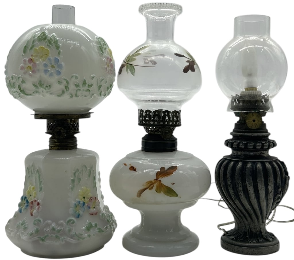 LOT OF 3 VINTAGE OIL LAMPS GLASS & METAL 9": LOT OF 3 VINTAGE MINIATURE OIL LAMPS MILK GLASS & METAL BASES Charming grouping of three vintage miniature oil lamps featuring classic milk glass bodies with decorative floral and botanical motifs, pa