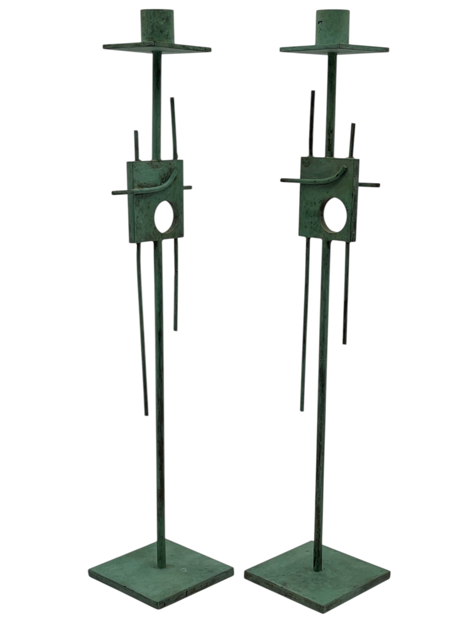 PAIR OF MODERNIST VERDIGRIS METAL CANDLE HOLDERS: PAIR OF TALL MODERNIST VERDIGRIS METAL CANDLE HOLDERS 15" H Pair of tall modernist metal candle holders in an abstract sculptural design with squared bases, slender upright stems, and geometric openwo