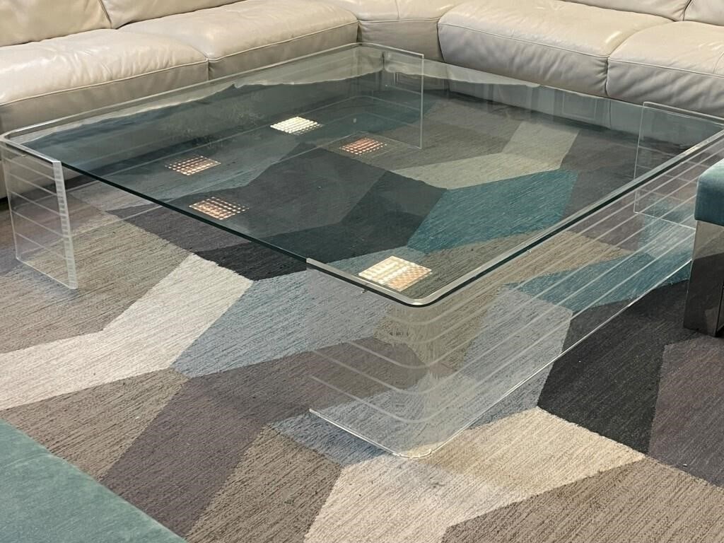 LARGE BEVELED GLASS LUCITE SLAB LEGS COFFEE TABLE: Large rectangular beveled glass top Thick clear Lucite slab legs in a sculptural waterfall design Legs appear to be solid acrylic panels with a wide pedestal base for stability Extremely clean minimal