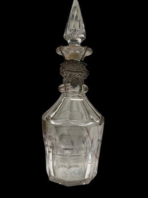 VINTAGE LEAD CRYSTAL BRANDY DECANTER W/ SILVER TAG: Heavy cut crystal decanterFaceted / paneled body with deep cuts (good sign of quality)Original style glass stopperDecorative grapevine liquor tag (?Brandy?)Likely part of a bar set (whiskey, scotch, b