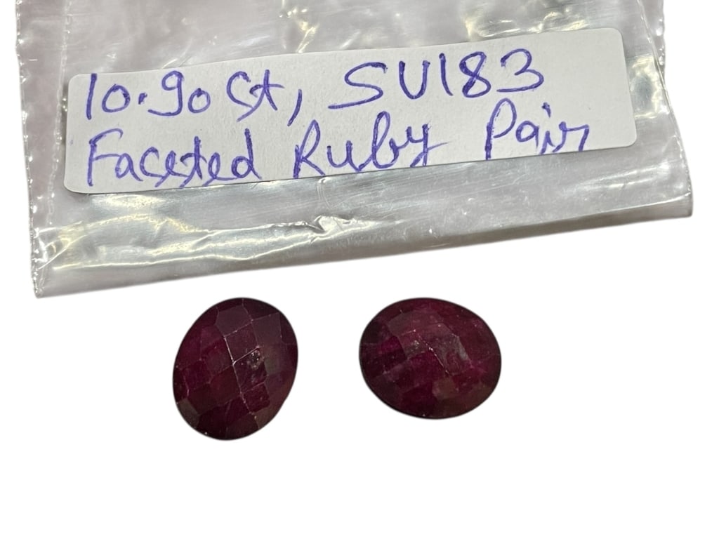 PAIR OF FACETED RUBIES TOTALING APPROX. 10.90 CARS: PAIR OF FACETED RUBIES TOTALING APPROX. 10.90 CARATS -This matched pair of faceted rubies displays a deep red hue with visible natural inclusions consistent with corundum, offered loose and ideal for