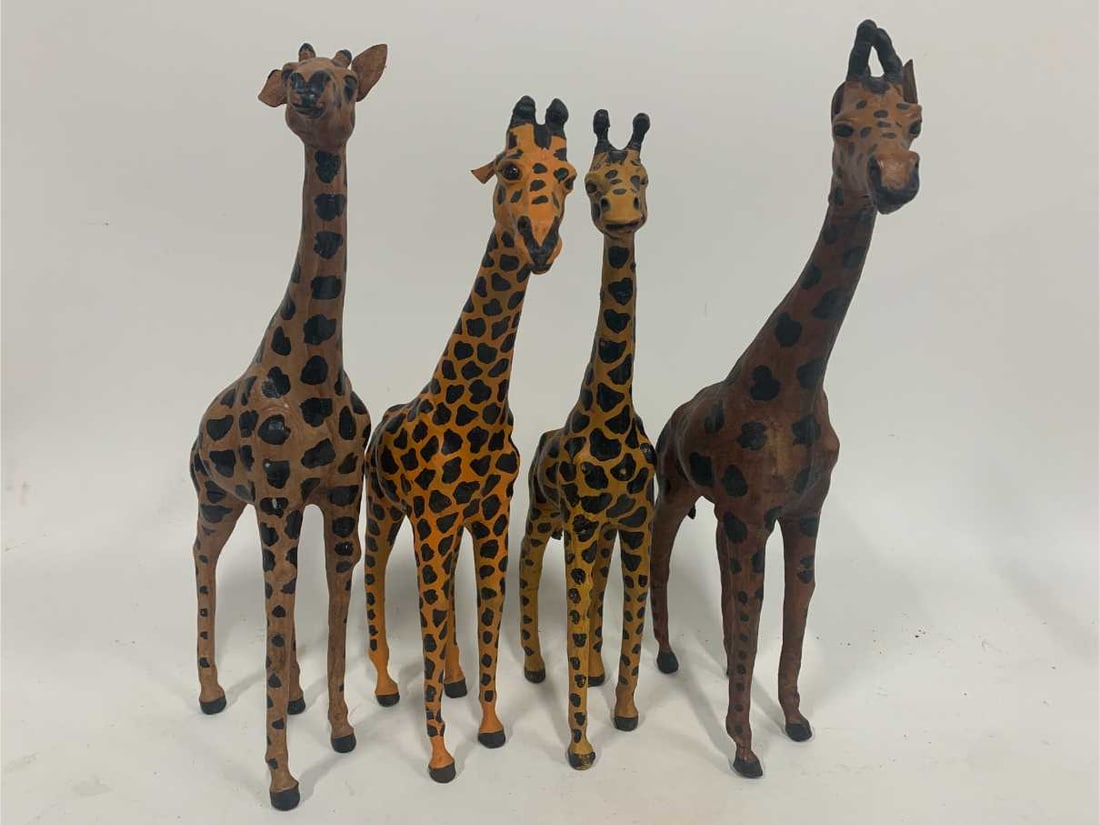 LOT OF FOUR 16" TO 18" GIRAFFE FIGURINE STATUES: - adorable giraffe figures - lot of four total 2 @ 16" 2 @ 18" great condition on all By bidding on this listing, you understand and agree to be bound by the terms and conditions of DejaVu Auctions. *