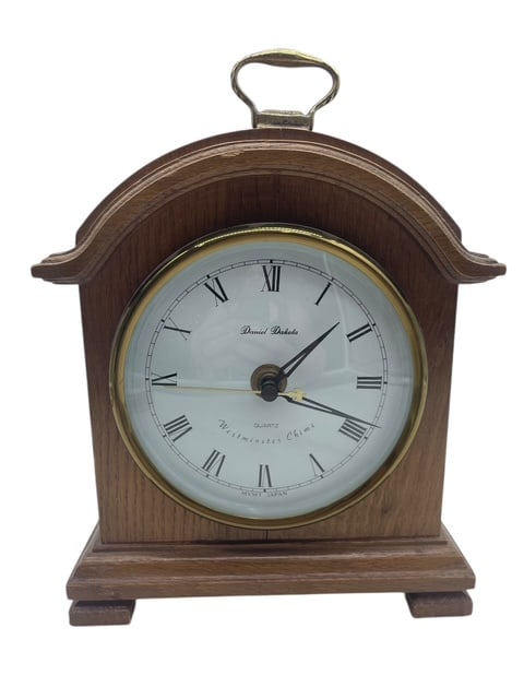 VTG DANIEL DAKOTA WESTMINSTER CHIME WOOD CLOCK: JAPAN QUARTZ MOVEMENT A couple of bites in the wood on the back 10" tallBy bidding on this listing, you understand and agree to be bound by the terms and conditions of DejaVu Auctions.*For ALTERNATE