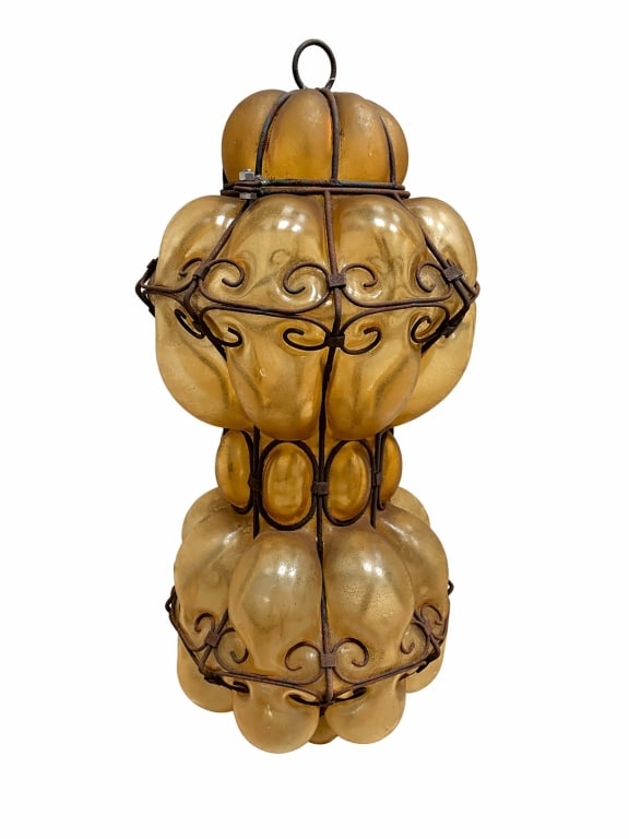 ANTIQUE IRON STRAPPED BLOWN AMBERY GLASS LANTERN: 18" IN HEIGHT, sold as a solo lantern, deadstock with original sales tag, never hung and in great condition! msn260421 ** THESE ITEMS WILL BE FOR PICK UP OFF SITE (IN DELRAY BEACH, FLORIDA) ONLY ON DE