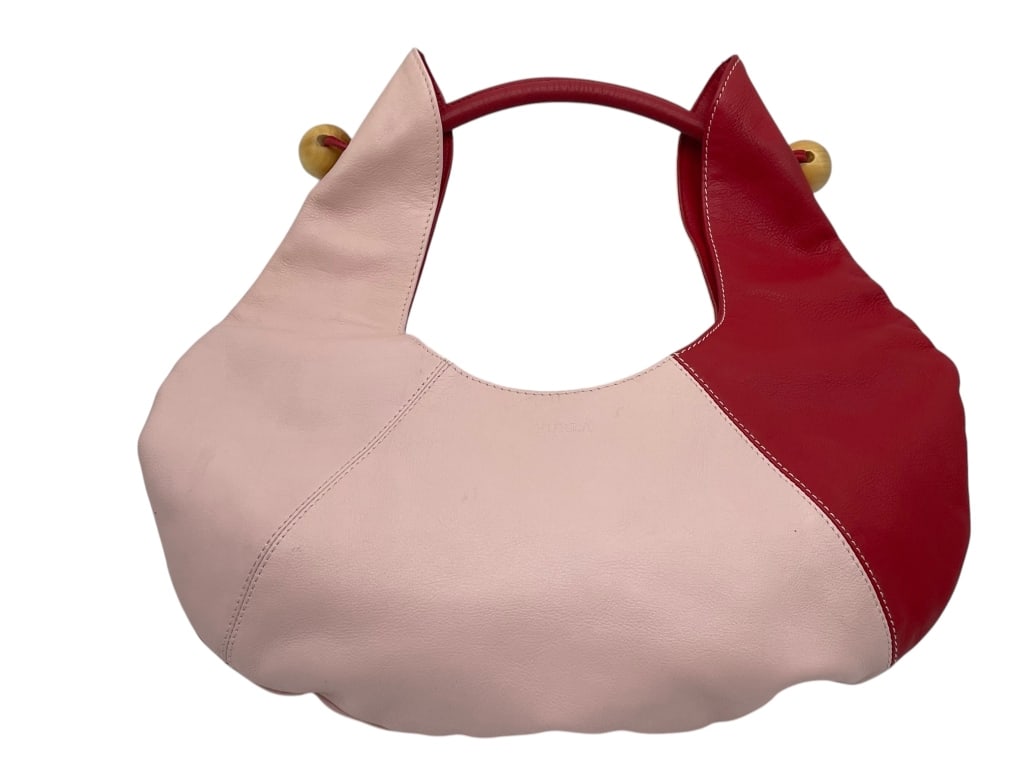 VTG MOD FURLA ITALY PINK RED DUO COLOR HOBO BAG: Modern Furla Italian leather shoulder bag featuring a sculptural, asymmetrical hobo silhouette in soft blush pink and red color-block leather. Designed with a rounded cut-out handle, gold-tone sphere 