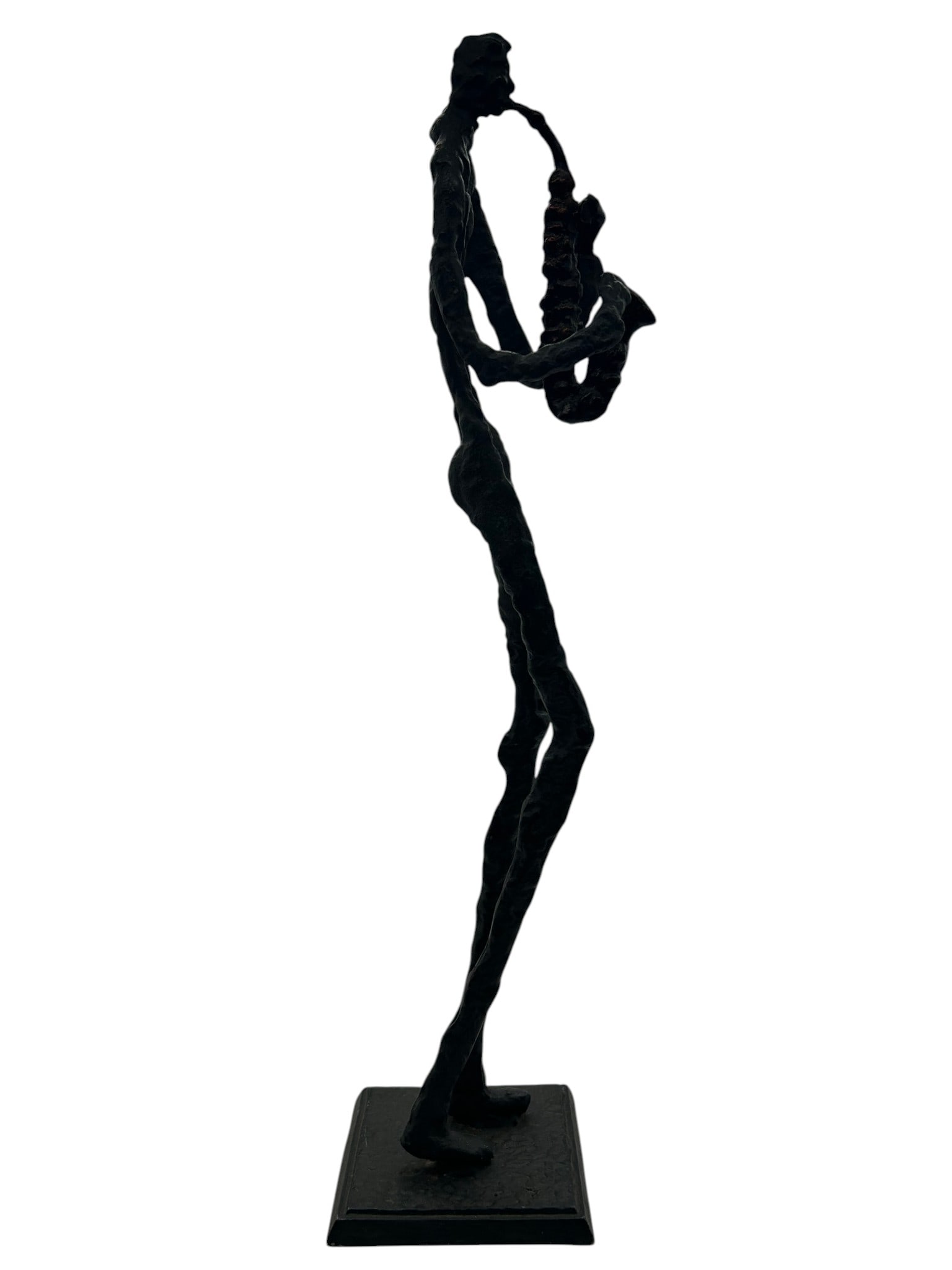 ABSTRACT BRONZE STYLE JAZZ MUSICIAN SCULPTURE 26": Expressive modernist figural sculpture depicting an elongated standing jazz musician playing a saxophone, rendered in a rough-textured abstract form with dark bronze-black patinated finish and subtle 