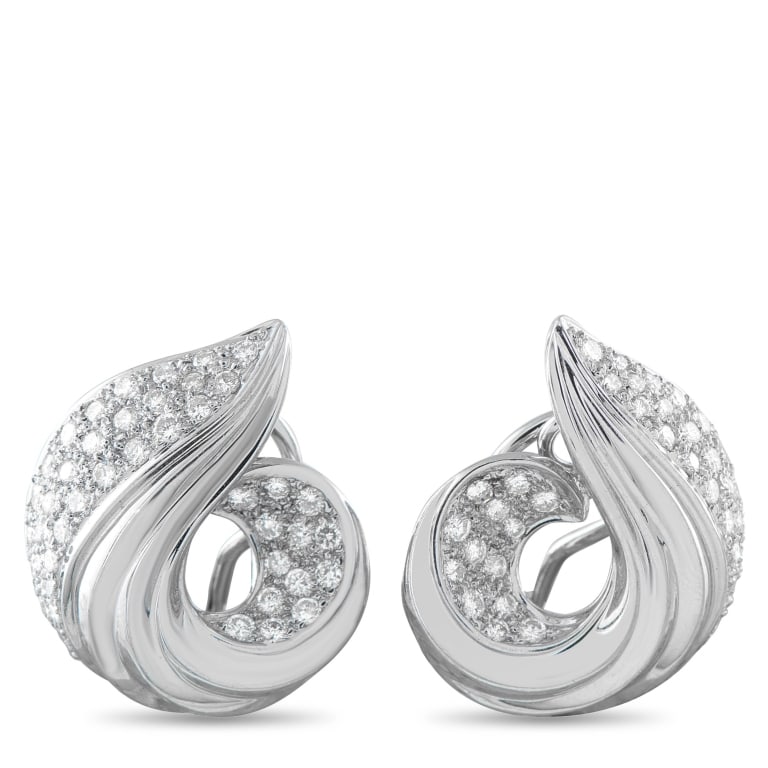 18K WHITE GOLD 1.72CT DIAMOND SWIRLED SHELL CLIP-O: With clear retro roots, these white gold clip-ons are shaped in a swirling form. The spiral silhouette features a ridged, polished surface and a diamond-pave segment, creating a play of texture as the